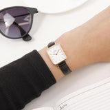 Daniel Wellington DW00100434__1 watch on wrist, black leather strap