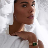 Woman wearing DW00100437-3_1 watch with green face