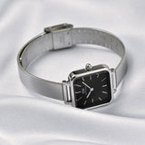 Silver square-face watch with black dial