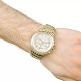 Gold wristwatch on wrist