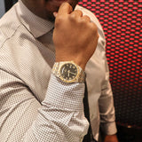 Man wearing a luxury gold watch, E61Ou_-WUAMcE78