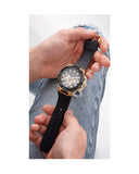 GW0423G2 black and gold watch on wrist