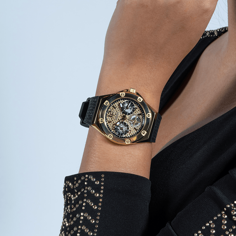 GW0620L2 Watch on wrist, gold and black design.