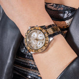 Luxury gold watch on wrist