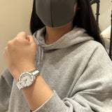 Woman wearing watch and gray hoodie, IMG_0978