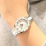 White watch on wrist