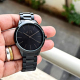 Black AX watch held in hand, photo from July 13, 2024.