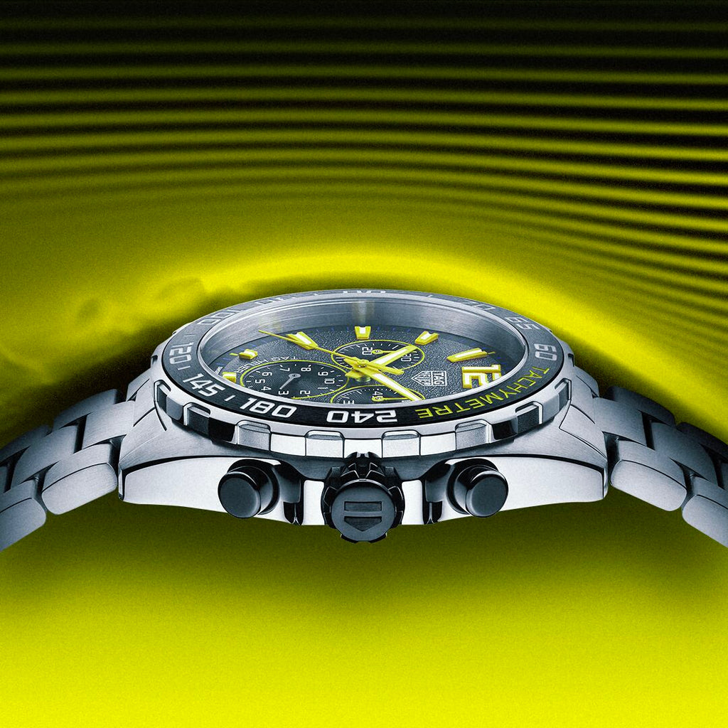 Tag Heuer CAZ101AG watch still life on yellow background