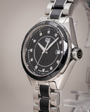 June 2024 TAG Heuer watch with black face and diamond accents.
