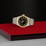 Tudor watch M28303-0003 with black dial and gold accents