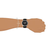 Man's wrist wearing black watch, 7-inch wrist.