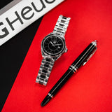WBJ141AA-BA0973 TAG Heuer watch with pen on red leather