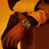 Man wearing CAZ101AG.BA0842 gold watch, lifestyle shot.