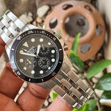 Fossil watch with black face and silver band