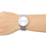 Silver wristwatch on wrist