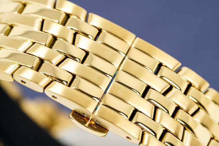 Gold watch band detail (c792e7b0-7f7a-4aa6-bb52-87eeb89b2845)