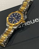 Tag Heuer watch with gold and silver accents