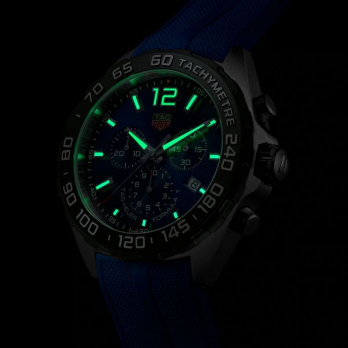 Tag Heuer Formula 1 Chronograph watch with glowing hands and numerals.
