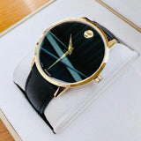 Movado men's watch with black face and gold accents