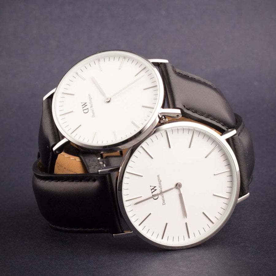 Two Daniel Wellington watches with black leather straps