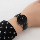 Daniel Wellington black watch on wrist