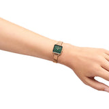 Rose gold watch with green face on wrist (dw00100520_4_1)