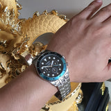 Fossil watch on wrist with turquoise accents
