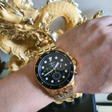 Gold Fossil watch on wrist