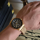 Gold Fossil watch on wrist