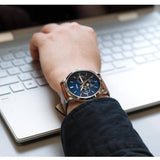 Fossil FS5903 watch on wrist by laptop