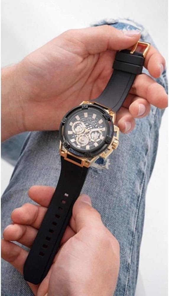 Guess Matrix Men's Watch held in hands