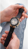 Guess Matrix Men's Watch held in hands