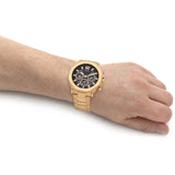 Guess men's watch with black dial, gold strap