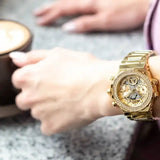 Guess women's gold watch with crystals and coffee