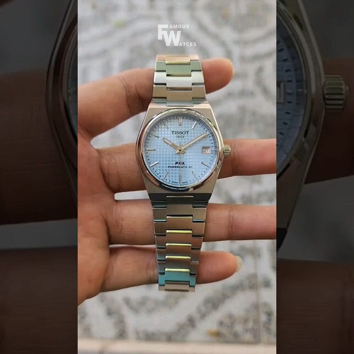 Tissot PRX watch held by hand, hq720