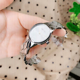 Calvin Klein watch held in hand, k6e23146-4