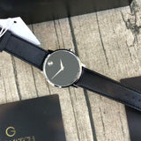 Movado watch with black leather strap