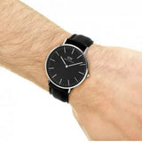 Daniel Wellington black leather watch on wrist