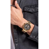 Guess gold watch on wrist