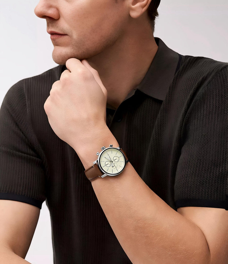 Man wearing product watch with brown leather strap