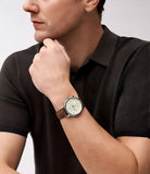 Man wearing product watch with brown leather strap