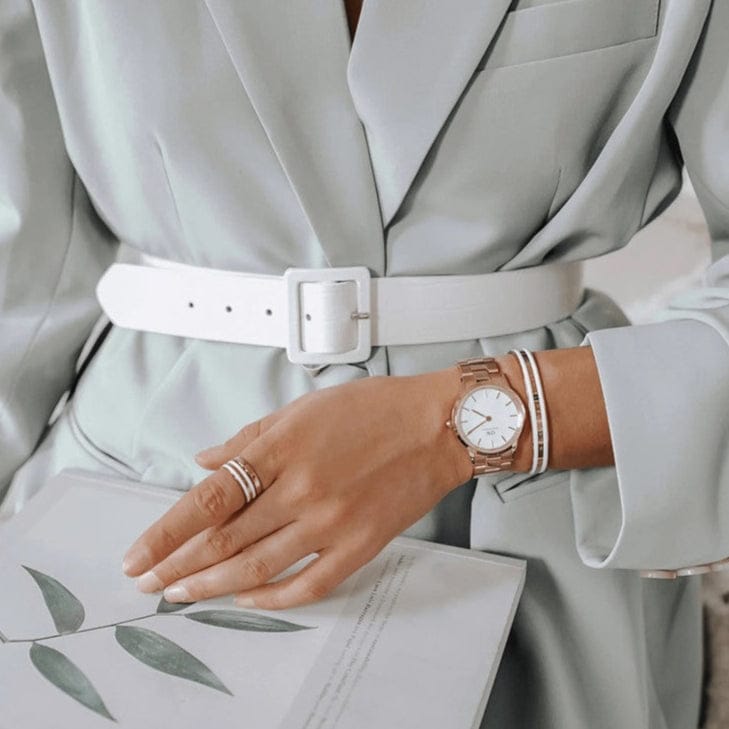 Daniel Wellington rose gold watch with white face on woman