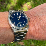 Tudor watch with blue dial on wrist