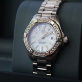 TAG Heuer Aquaracer watch with diamond bezel