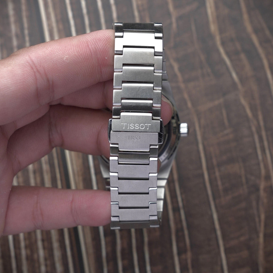 Tissot watch clasp and band detail, model t137-407-11-351-00-1