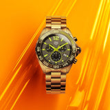 Tag Heuer Formula 1 CAZ101AGBA0842 gold watch on orange background