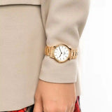 Gold wristwatch on wrist