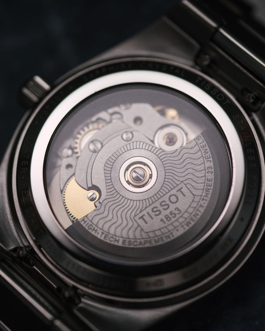 Winding Crowns Tissot watch back with visible movement