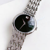 Movado watch with black dial and silver bracelet