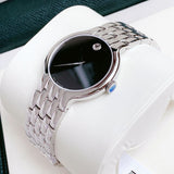 Movado watch with black face on display.